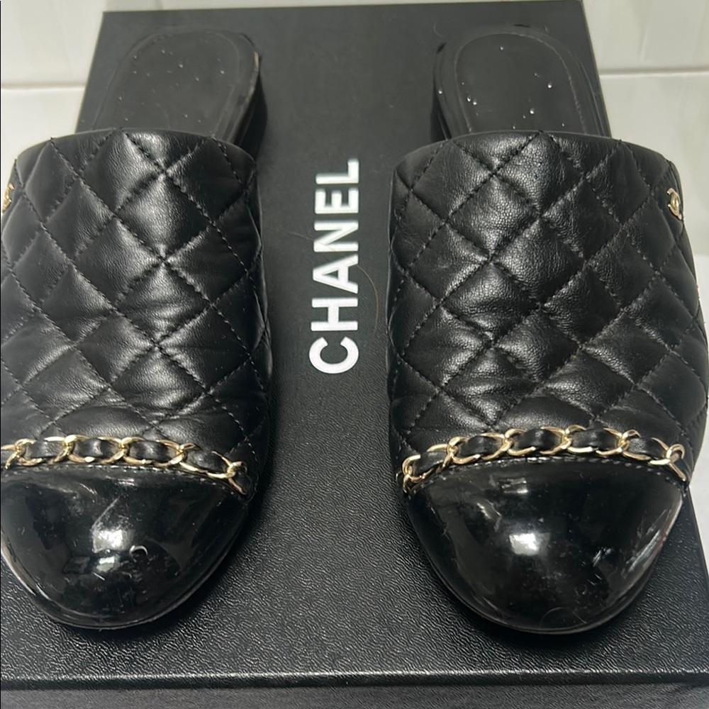 CHANEL Black Quilted Mules with Gold Chain Detail